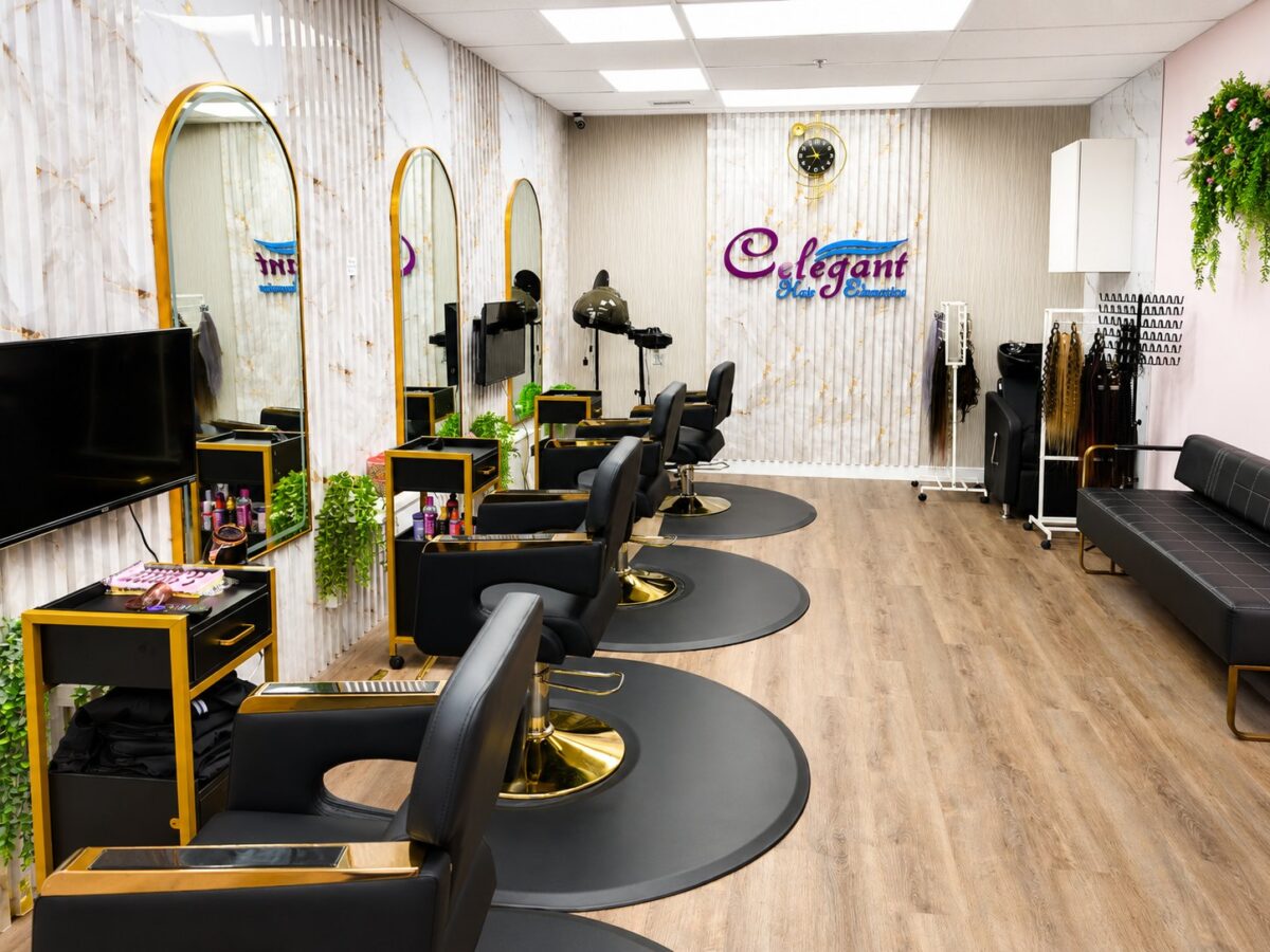 The Celegant training salon in Edmonton: styling chairs, mirrors and a wall of braiding hair