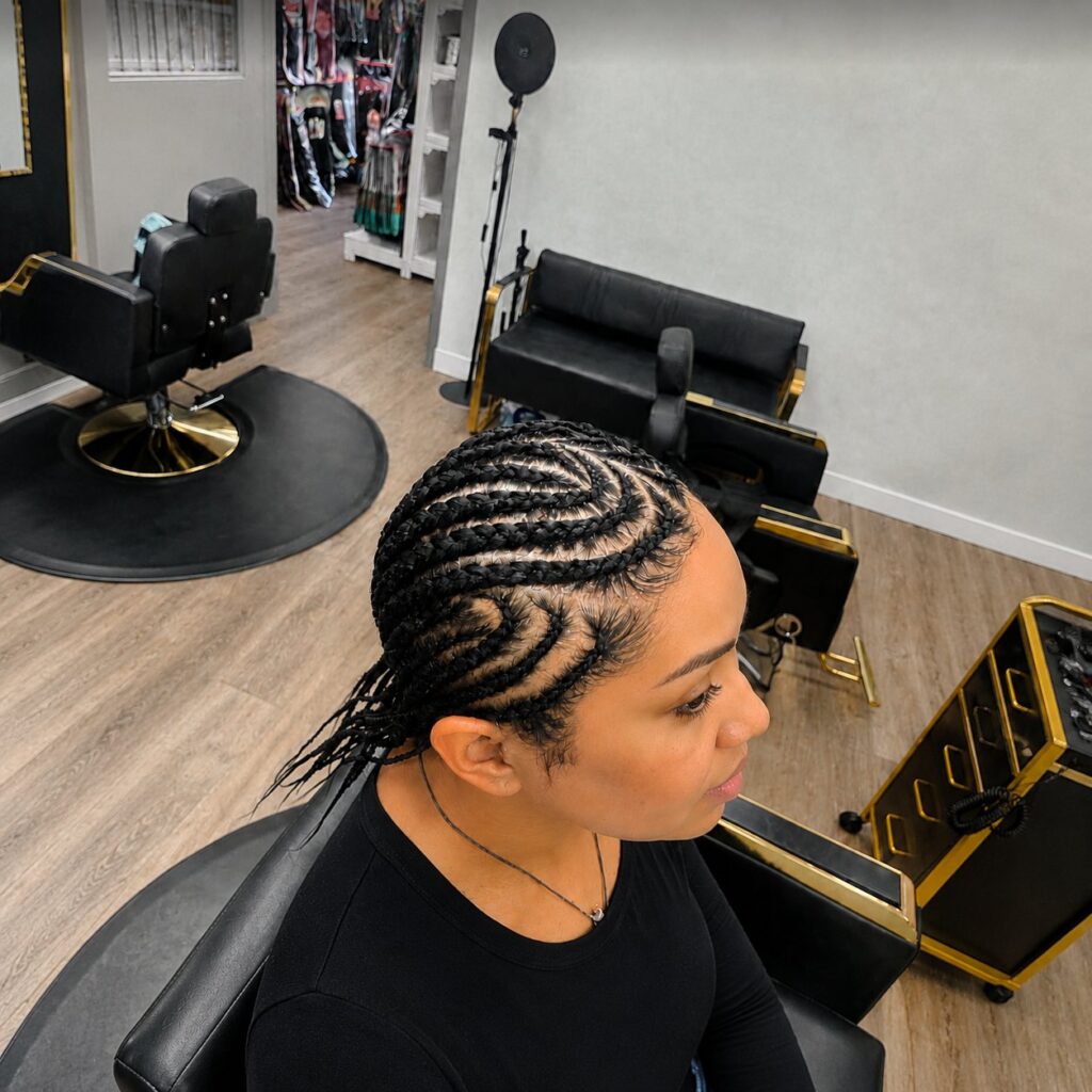 Straight-back stitch cornrows with feed-in braids, seen from above